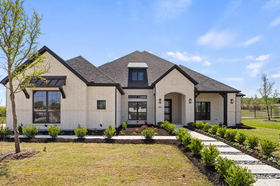 Front exterior of a home in the Winding Creek community, located in Rockwall, TX (Image 3).