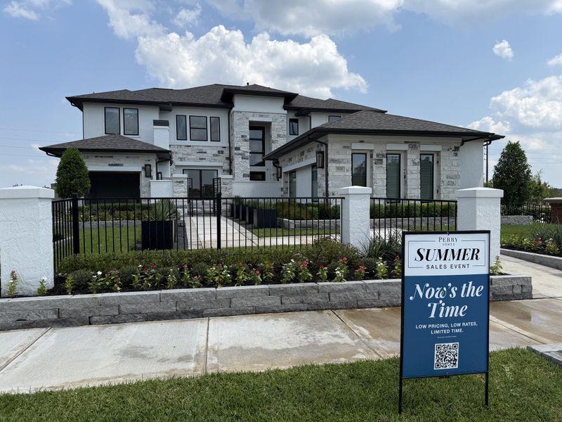 A modern two-story home with stone accents and landscaped gardens in Sienna 65' - Valencia by Perry Homes (Missouri City, TX). A modern two-story home with stone accents and landscaped gardens in Sienna 65' - Valencia by Perry Homes (Missouri City, TX).