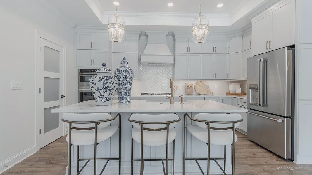 Furnished interior in a model home at The Courtyards at Redbud Lane in Holly Springs (Image 21).