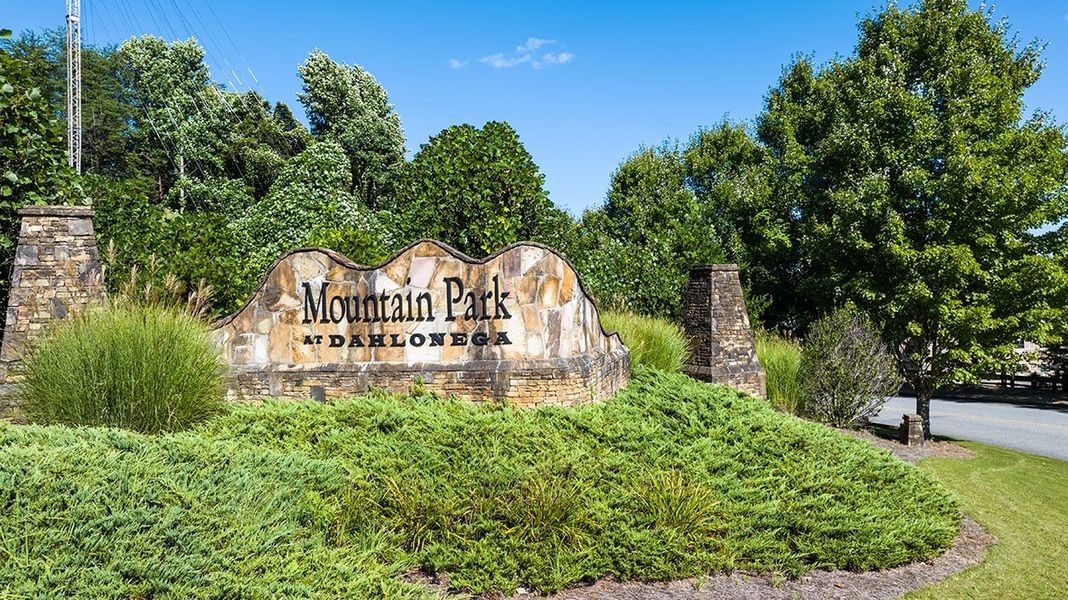 Entrance to the Mountain Park community in Dahlonega, GA, featuring signage and landscaping (Image 2).