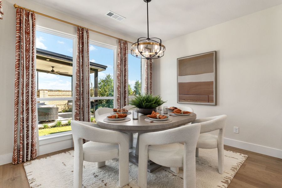 Plan 1687 North Sky 65s Casual Dining Photo by American Legend Homes