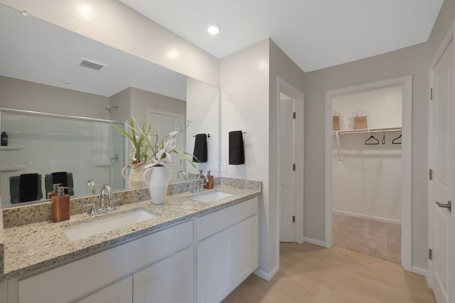 A bathroom with a large mirror. A bathroom with a large mirror.