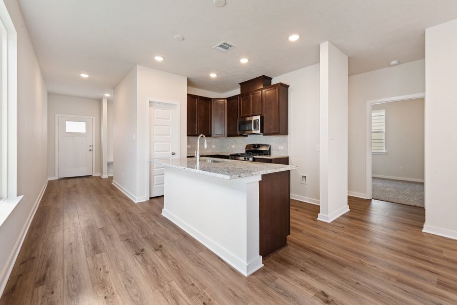 Furnished interior in a model home at Heartland at Vintage Farms in Brenham (Image 11).