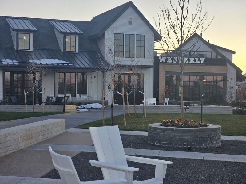 A modern community center in Westerly by SLC Homes, featuring cozy seating and landscaped grounds (Erie, CO).