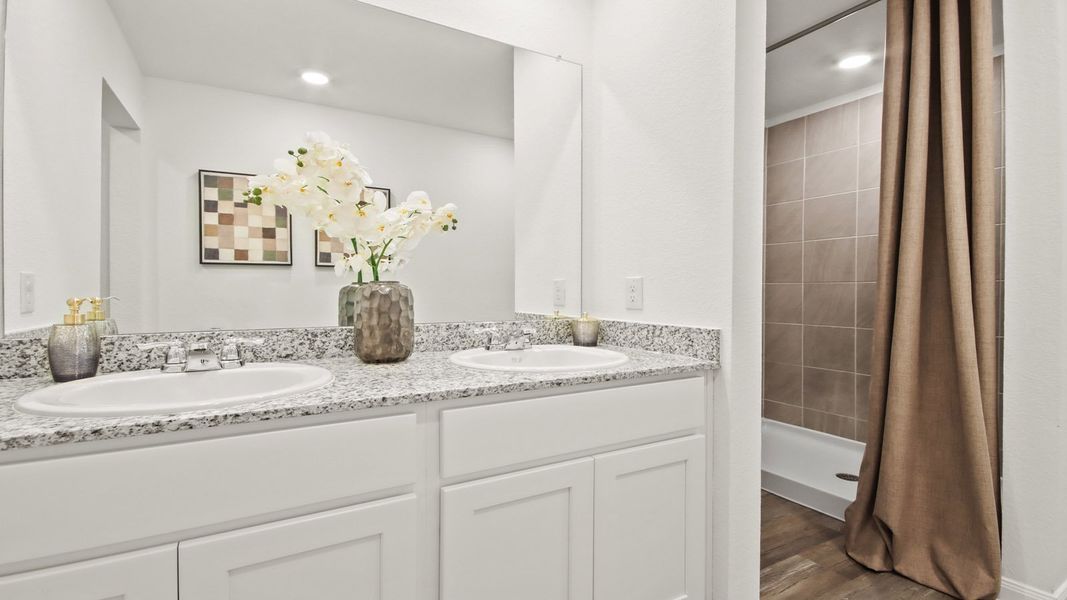 Furnished interior in a model home at McCrorey Trails in Conroe (Image 9).