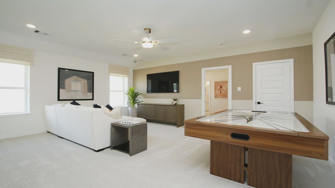 Immerse in luxury with sleek modern furnishings, pristine finishes, and a chic game table in The Woodlands Hills.
