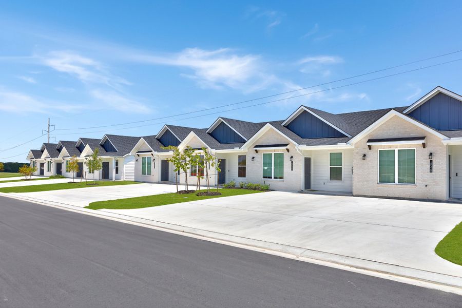 Front exterior of a home in the Townhomes at Yaupon Trails community, located in Bryan, TX (Image 4).