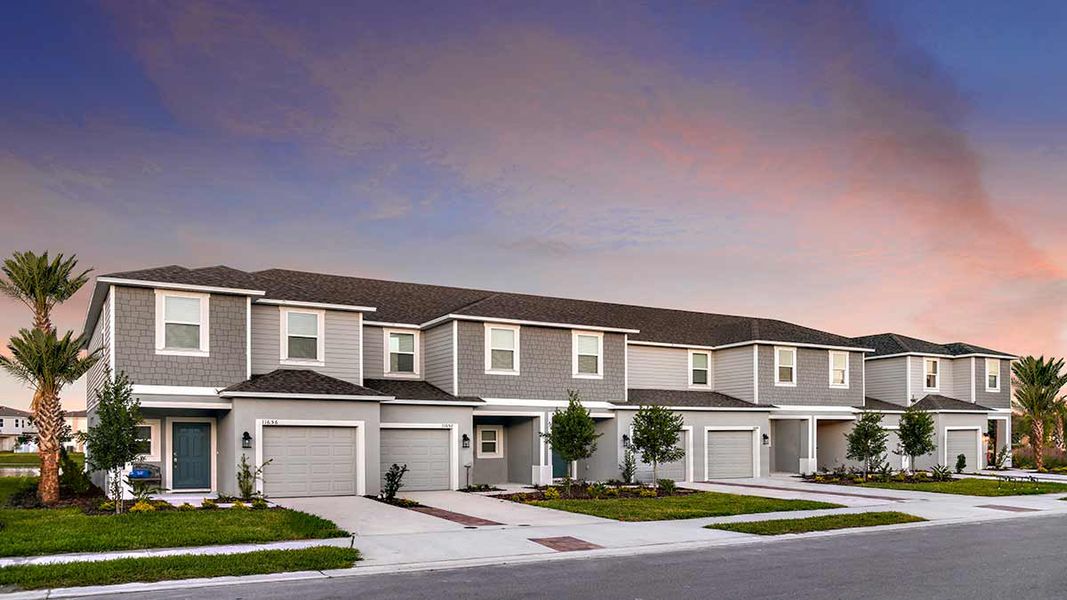 Front exterior of a home in the The Townhomes at Skye Ranch community, located in Sarasota, FL (Image 19).