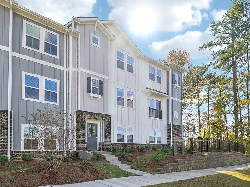 Front exterior of a home in the Meadows at Wilson Farms - The Heights Series community, located in Fort Mill, SC (Image 1).