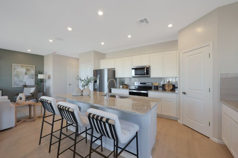 A kitchen with white cabinets. A kitchen with white cabinets.