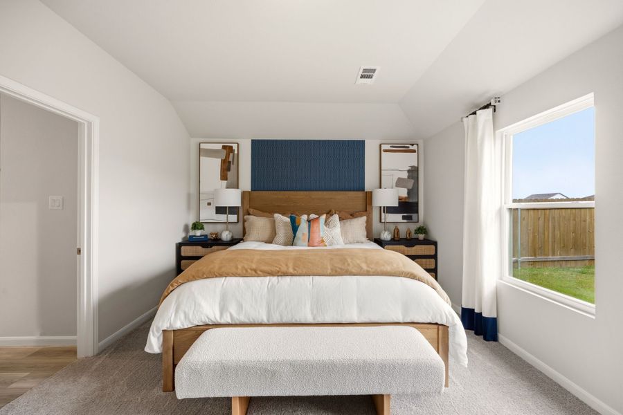 A bedroom with a large bed. A bedroom with a large bed.