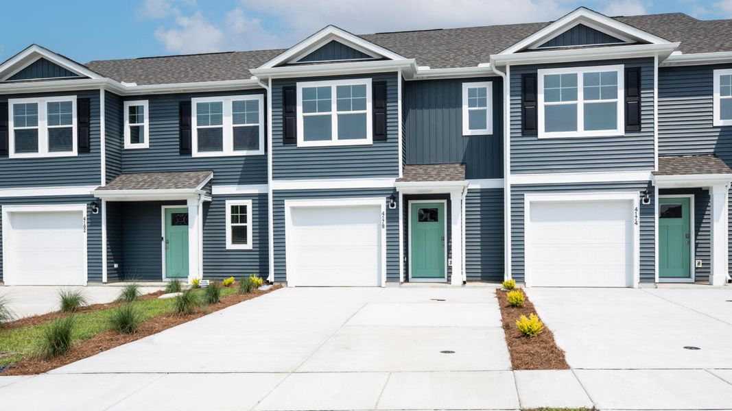 Front exterior of a home in the Townes at Seabrooke community, located in Leland, NC (Image 4).