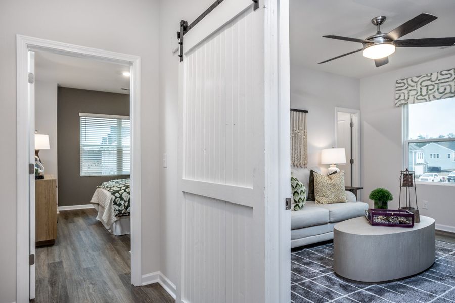 Furnished interior in a model home at Coastal Haven Townes in Leland (Image 7).