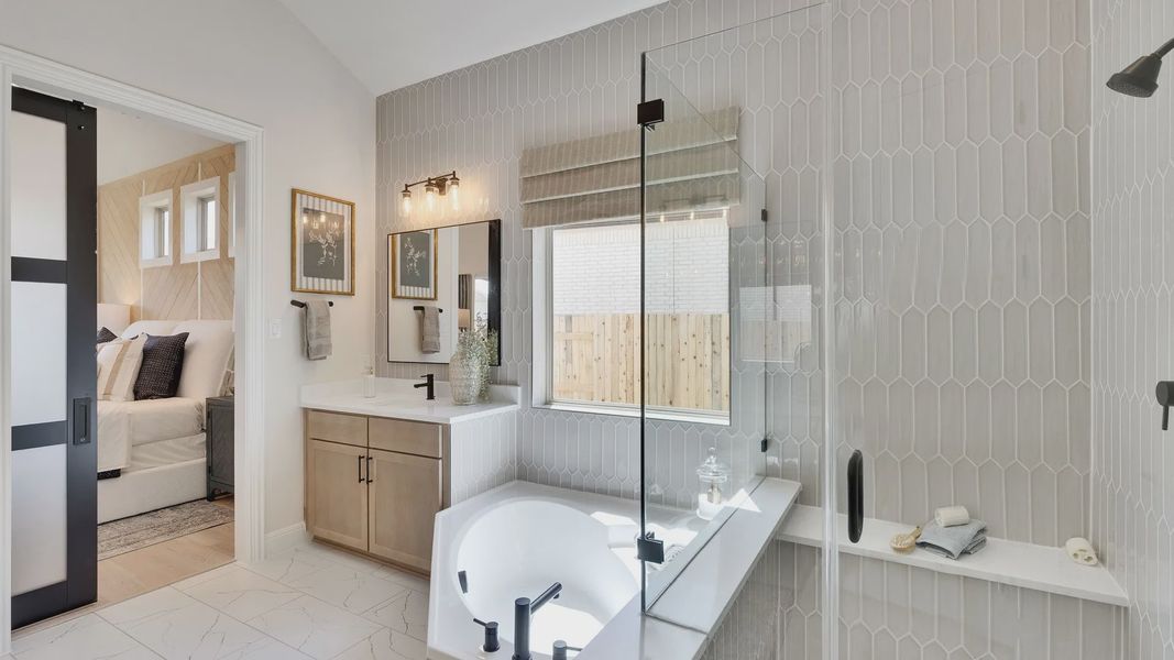 Indulge in luxury with hexagonal tiles and a sleek glass shower. Experience Sunfield's finest. Indulge in luxury with hexagonal tiles and a sleek glass shower. Experience Sunfield's finest.