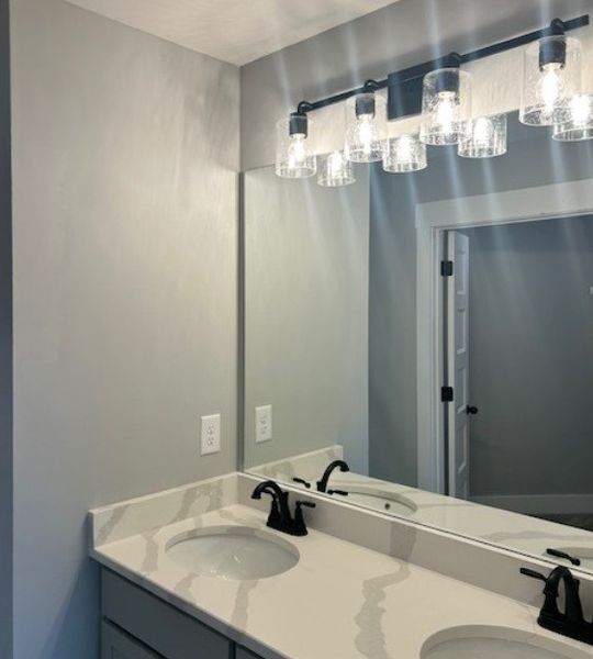 Primary bathroom with quartz countertops