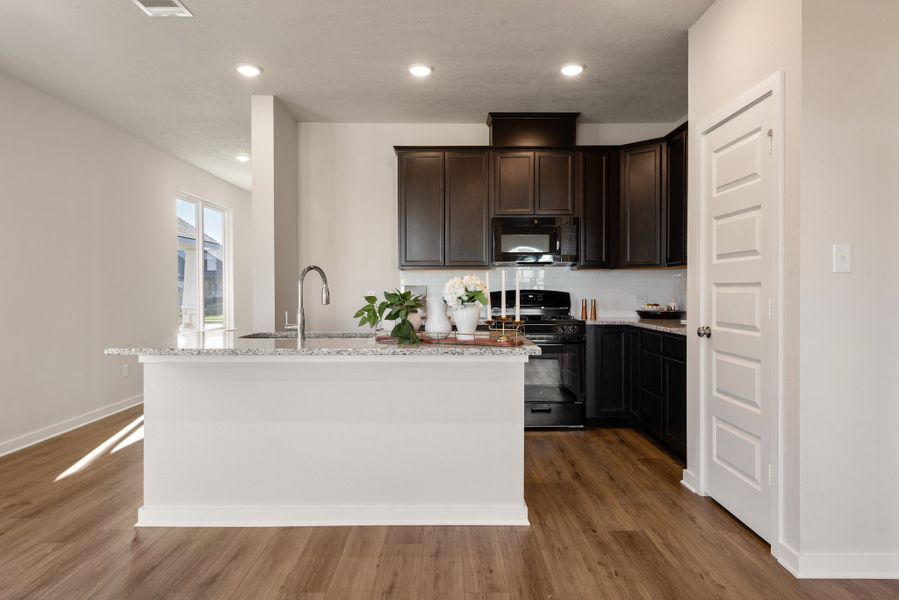 Furnished interior in a model home at Heartland at Vintage Farms in Brenham (Image 6).