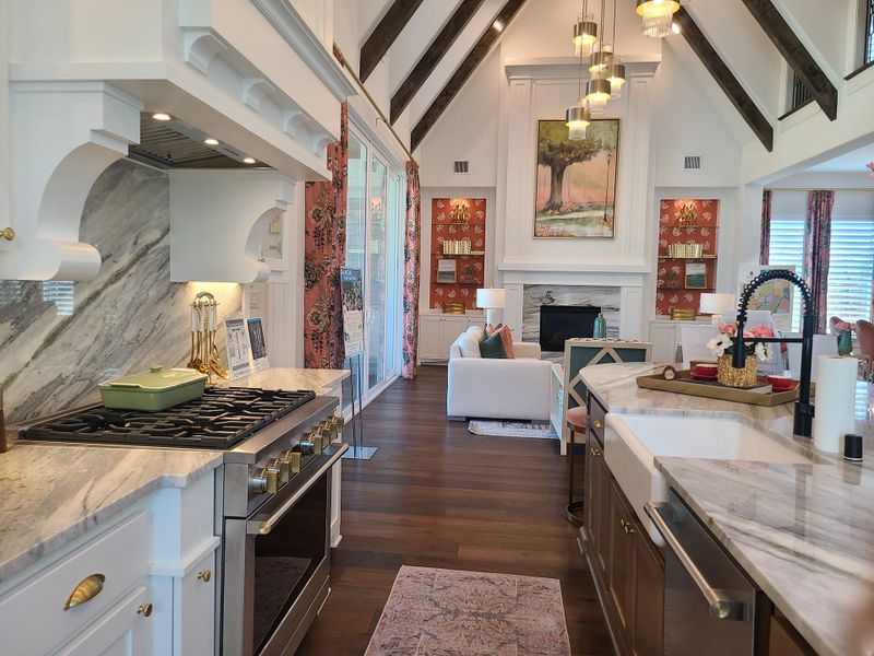 A luxurious kitchen-living space with marble countertops, high ceilings, and elegant touches for a modern aesthetic. A luxurious kitchen-living space with marble countertops, high ceilings, and elegant touches for a modern aesthetic.