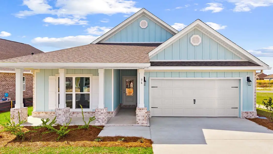 Front exterior of a home in the Owl's Head Farms community, located in Freeport, FL (Image 3).