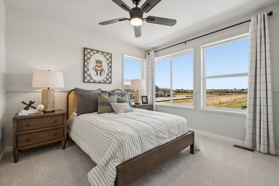 A bedroom with a bed and a window. A bedroom with a bed and a window.