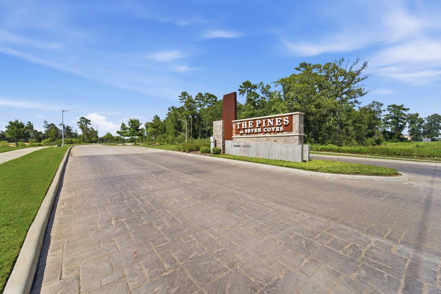Entrance to the The Pines at Seven Coves community in Willis, TX, featuring signage and landscaping (Image 12).