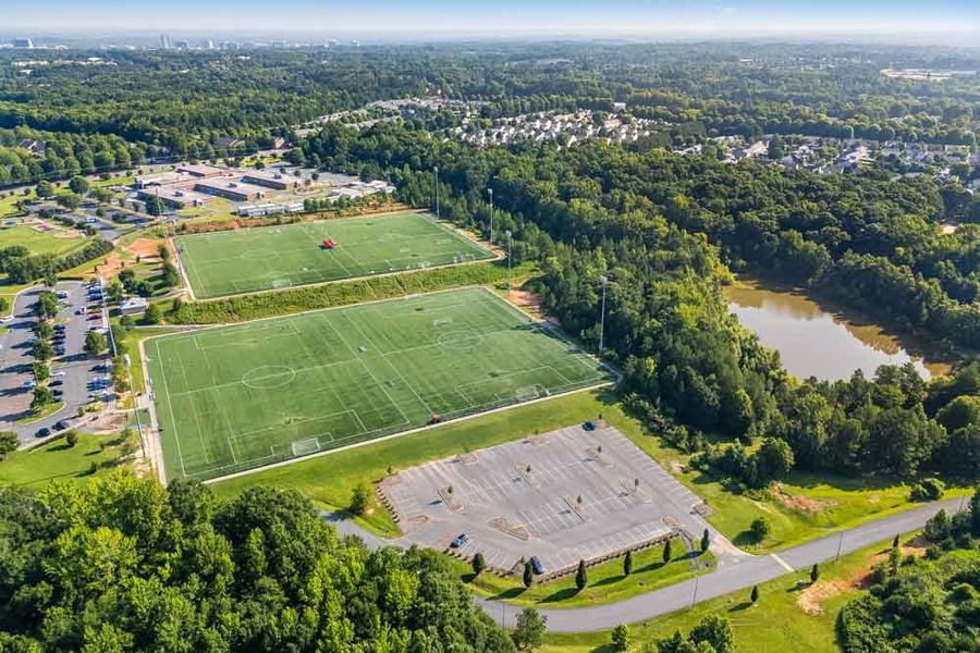 Aerial view of the Terraces at the Exchange community in Indian Land, SC, showing layout and nearby surroundings (Image 15). Aerial view of the Terraces at the Exchange community in Indian Land, SC, showing layout and nearby surroundings (Image 15).