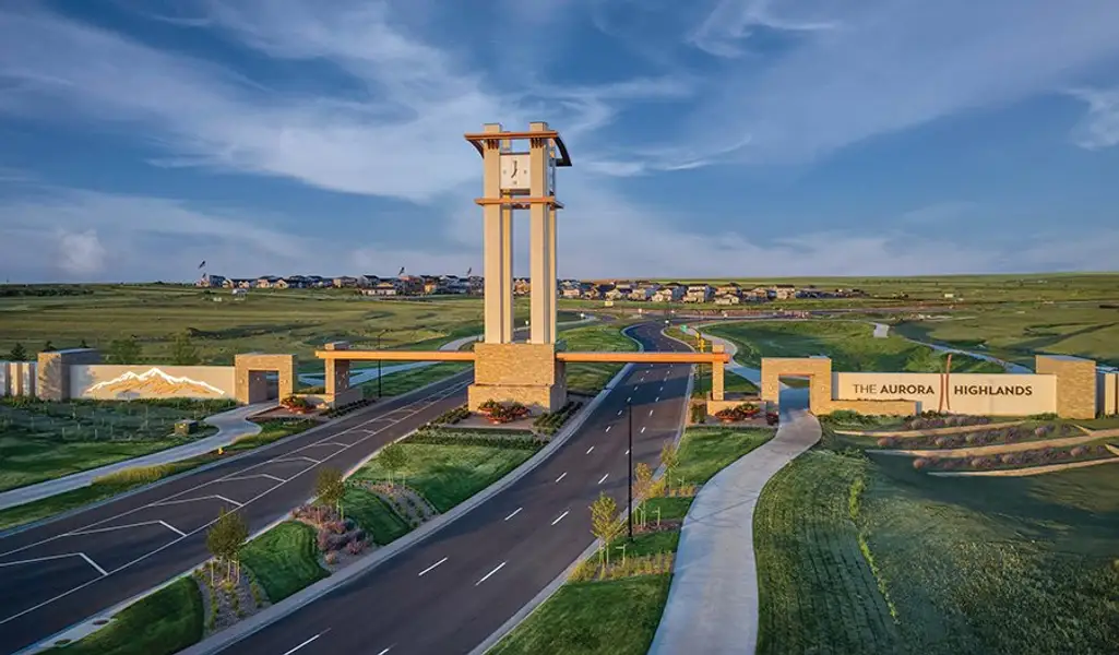 Entrance to the The Bend at The Aurora Highlands community in Aurora, CO, featuring signage and landscaping (Image 2).