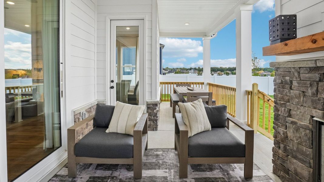 Spacious rear covered patio with access to the rear entry of home Spacious rear covered patio with access to the rear entry of home