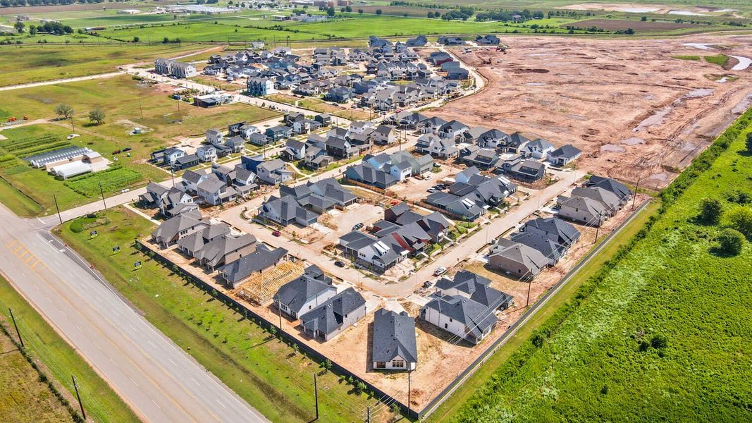 Aerial view of the Indigo: 40ft. lots community in Richmond, TX, showing layout and nearby surroundings (Image 14). Aerial view of the Indigo: 40ft. lots community in Richmond, TX, showing layout and nearby surroundings (Image 14).