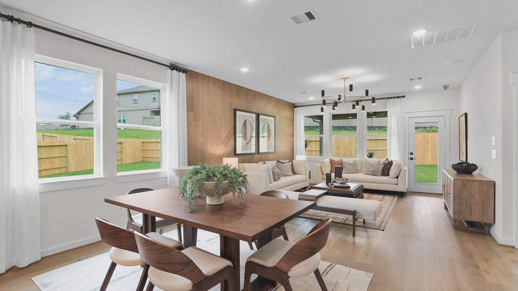 Luxurious wood accents and chic fixtures enhance this Mostyn Springs living room. Luxurious wood accents and chic fixtures enhance this Mostyn Springs living room.