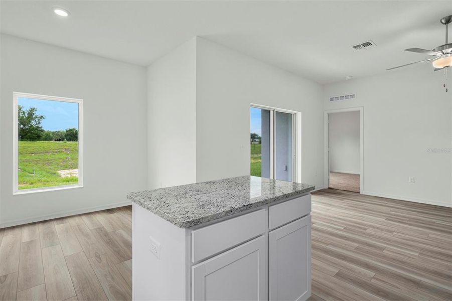 Furnished interior view inside a new home in Tula Parc, Astatula (Image 6).