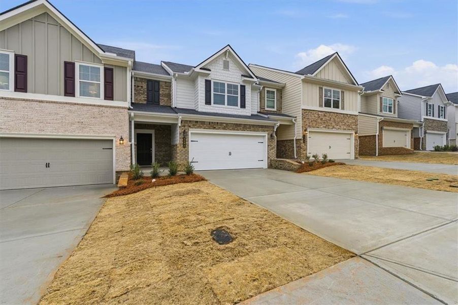 Front exterior of a new home in Park Center Pointe, Mableton, GA, highlighting curb appeal (Image 20).