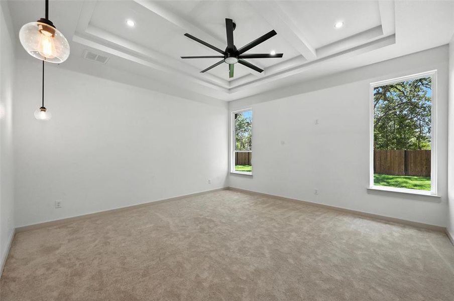 Spare room with carpet flooring, recessed lighting, ceiling fan, beamed ceiling, and a tray ceiling Spare room with carpet flooring, recessed lighting, ceiling fan, beamed ceiling, and a tray ceiling