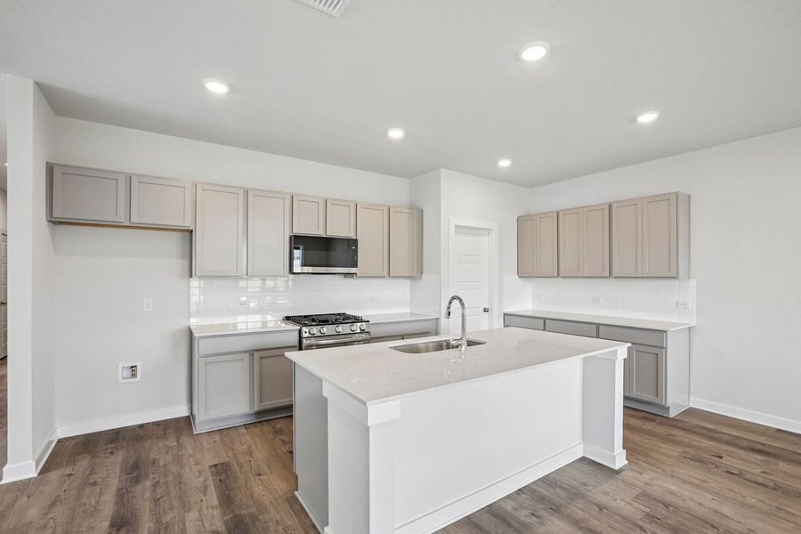Furnished interior view inside a new home in Stallion Run, Buda (Image 7).