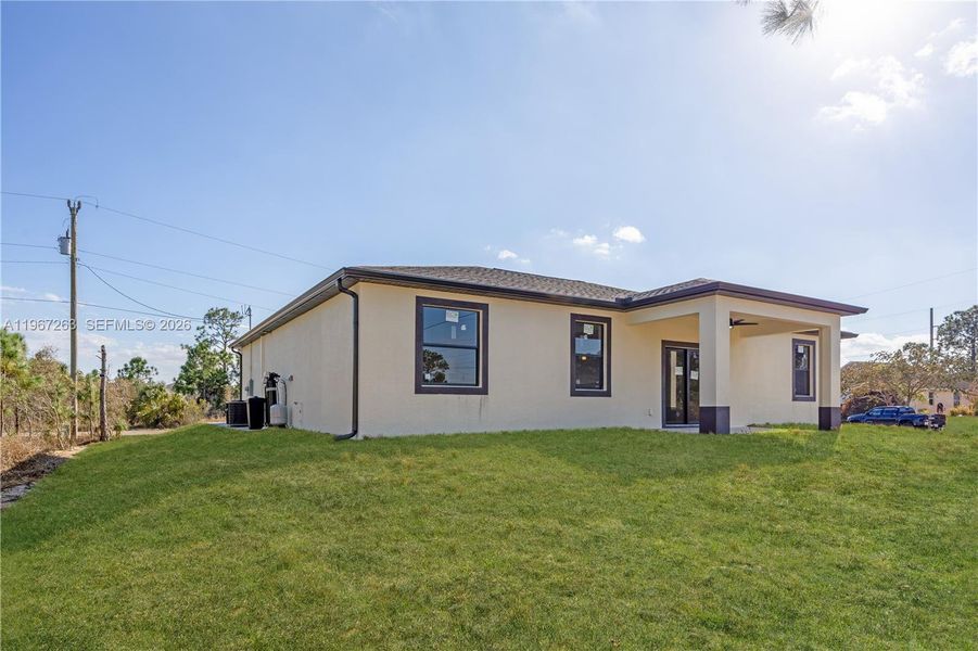 Exterior details and patio area of a home in , Lehigh Acres (Image 4). Exterior details and patio area of a home in , Lehigh Acres (Image 4).