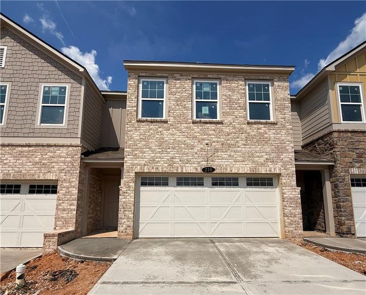 Front exterior of a new home in Leydenview, Mableton, GA, highlighting curb appeal (Image 2).