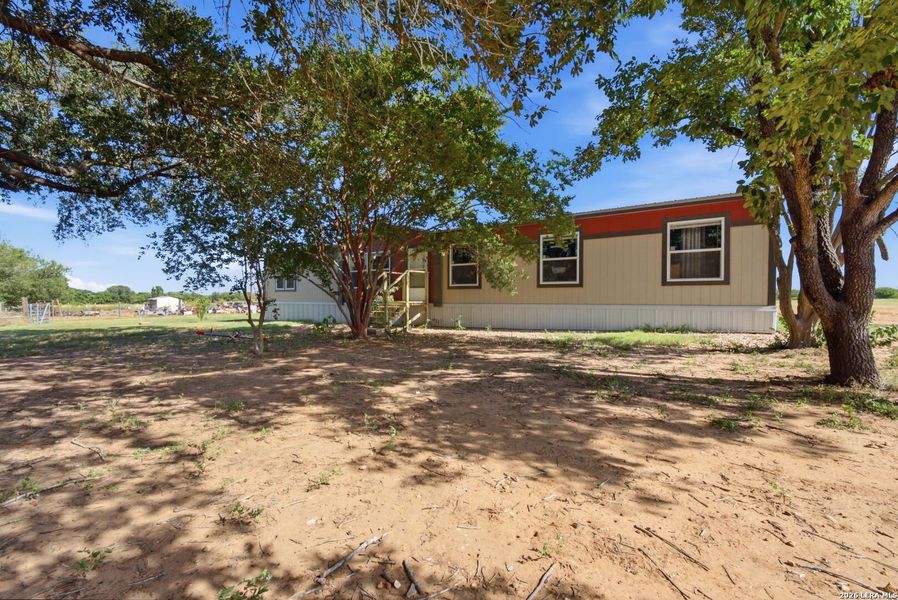 Exterior details and patio area of a home in , Devine (Image 21).