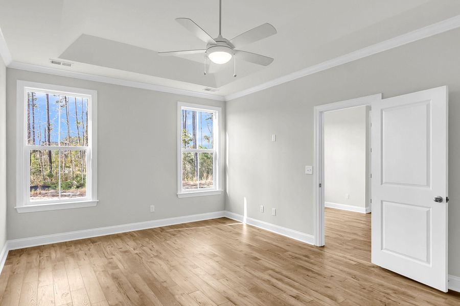 Spacious, unfurnished interior of a new home in Tidewater at Lakes of Cane Bay, Summerville (Image 44).