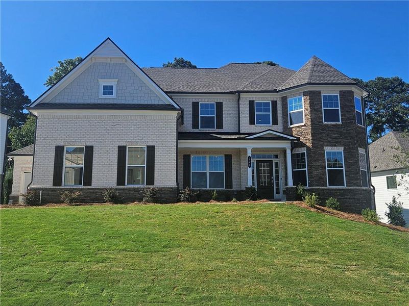 Front exterior of a new home in Deer Valley, Canton, GA, highlighting curb appeal (Image 1). Front exterior of a new home in Deer Valley, Canton, GA, highlighting curb appeal (Image 1).
