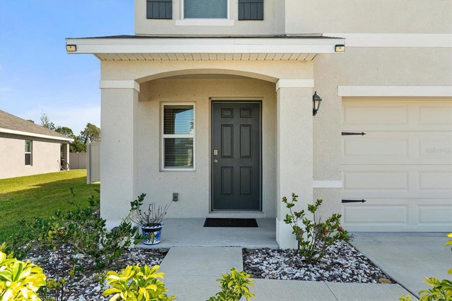 Front exterior of a new home in Silverstone North, Palmetto, FL, highlighting curb appeal (Image 2).