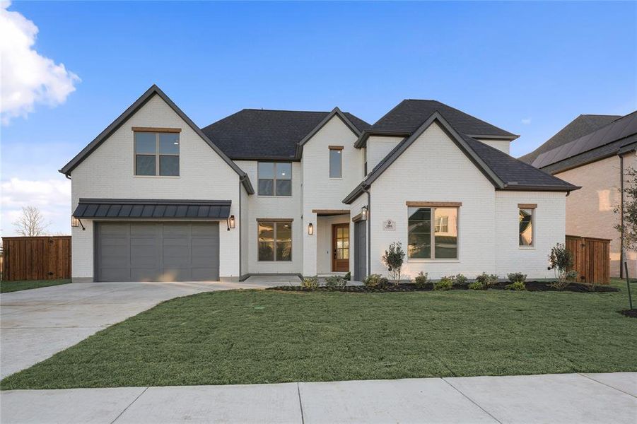 Front exterior of a new home in Light Farms Graham/Reagan, Celina, TX, highlighting curb appeal (Image 25).