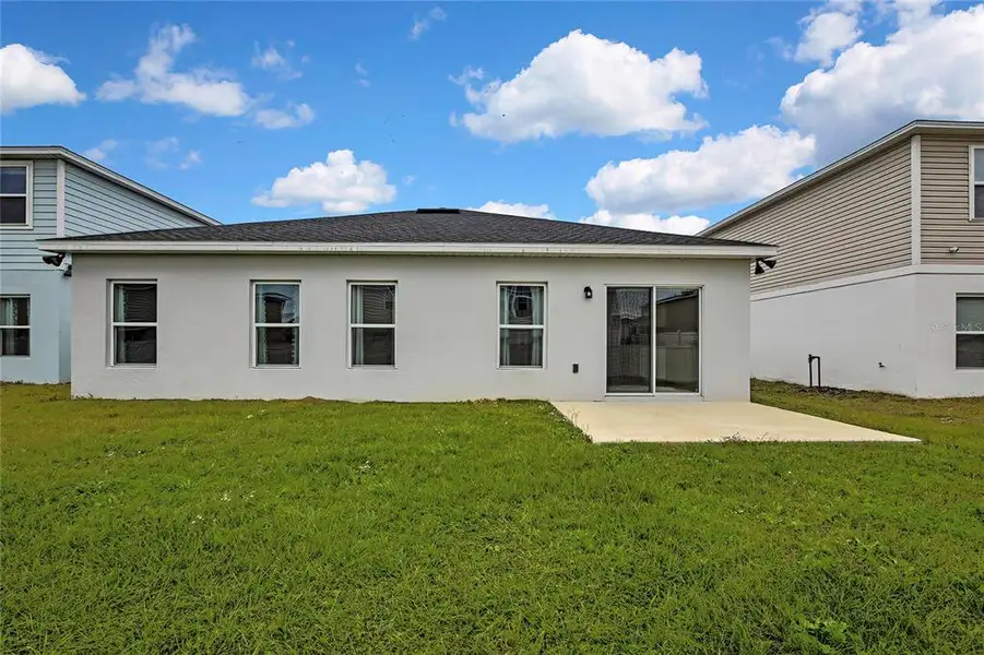 Front exterior of a new home in , Sumterville, FL, highlighting curb appeal (Image 1).