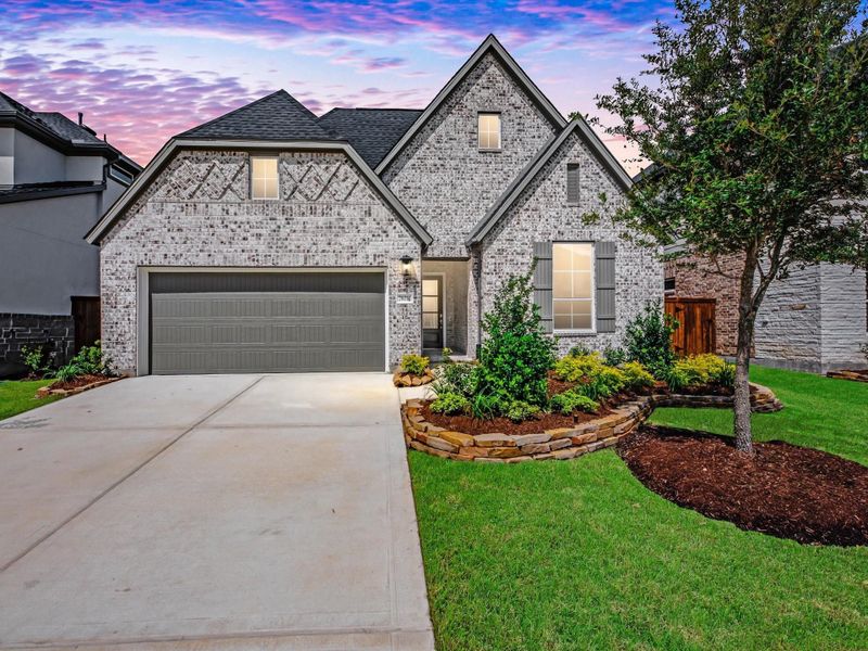 Front exterior of a new home in Tompkins Reserve, Katy, TX, highlighting curb appeal (Image 1). Front exterior of a new home in Tompkins Reserve, Katy, TX, highlighting curb appeal (Image 1).