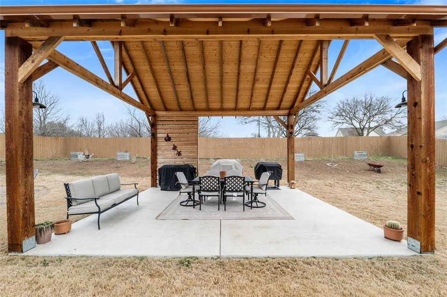 View of patio with an outdoor hangout area