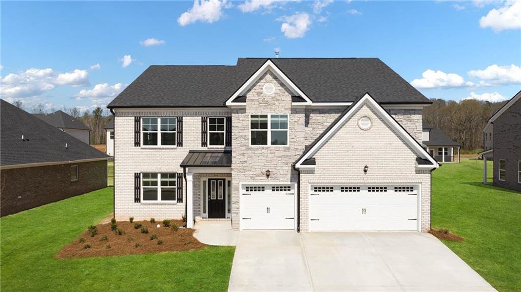 Front exterior of a new home in The Gates at Pates Creek, Hampton, GA, highlighting curb appeal (Image 1). Front exterior of a new home in The Gates at Pates Creek, Hampton, GA, highlighting curb appeal (Image 1).