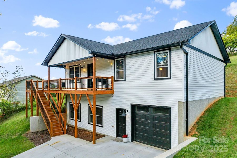 This home features a 1 car garage & a parking pad for 2 cars on a quiet rural street. This home features a 1 car garage & a parking pad for 2 cars on a quiet rural street.