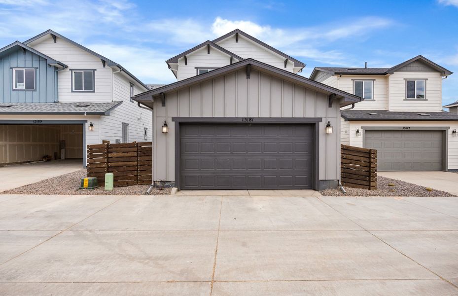 Front exterior of a new home in Barefoot Village, Firestone, CO, highlighting curb appeal (Image 24). Front exterior of a new home in Barefoot Village, Firestone, CO, highlighting curb appeal (Image 24).