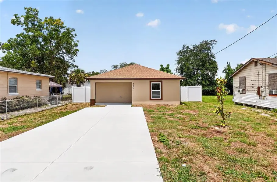 Front exterior of a new home in , Winter Haven, FL, highlighting curb appeal (Image 1). Front exterior of a new home in , Winter Haven, FL, highlighting curb appeal (Image 1).