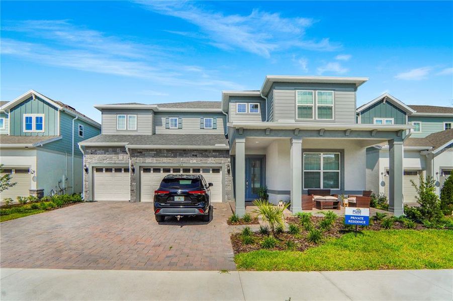Front exterior of a new home in , Winter Garden, FL, highlighting curb appeal (Image 28). Front exterior of a new home in , Winter Garden, FL, highlighting curb appeal (Image 28).