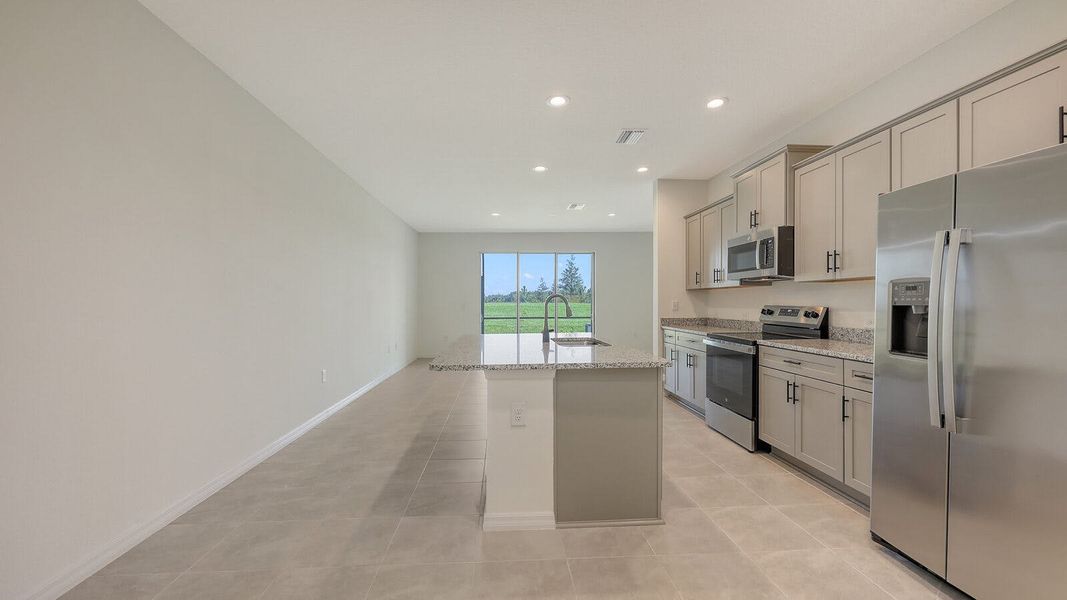 Furnished interior view inside a new home in Palm Grove Real Estate and Homes for Sale in Lakewood Ranch, FL - Neal Communities, Lakewood Ranch (Image 10).