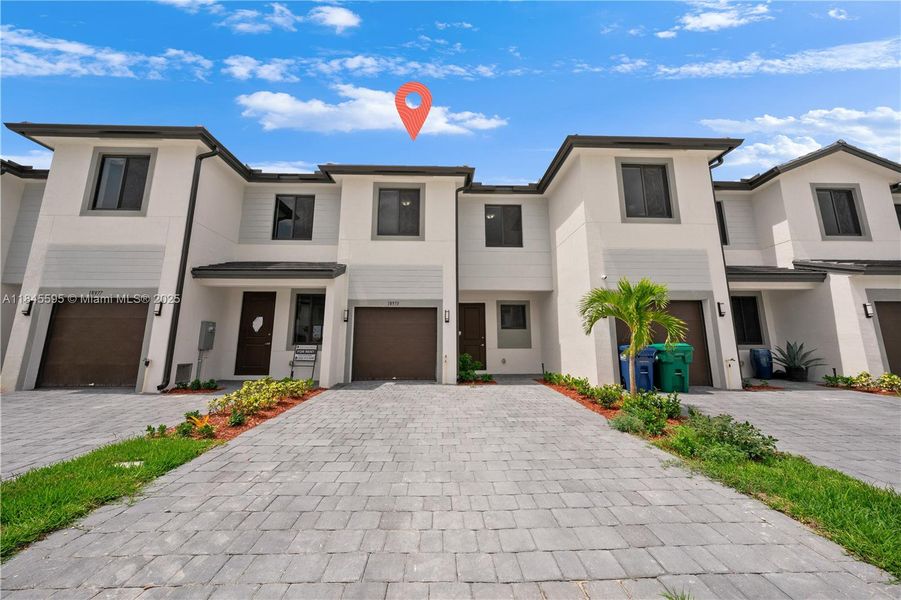 Front exterior of a new home in , Florida City, FL, highlighting curb appeal (Image 1).
